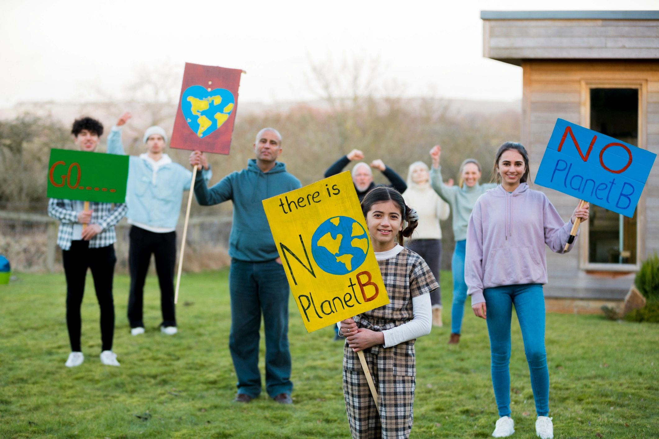 Community members holding signs during an advocacy event