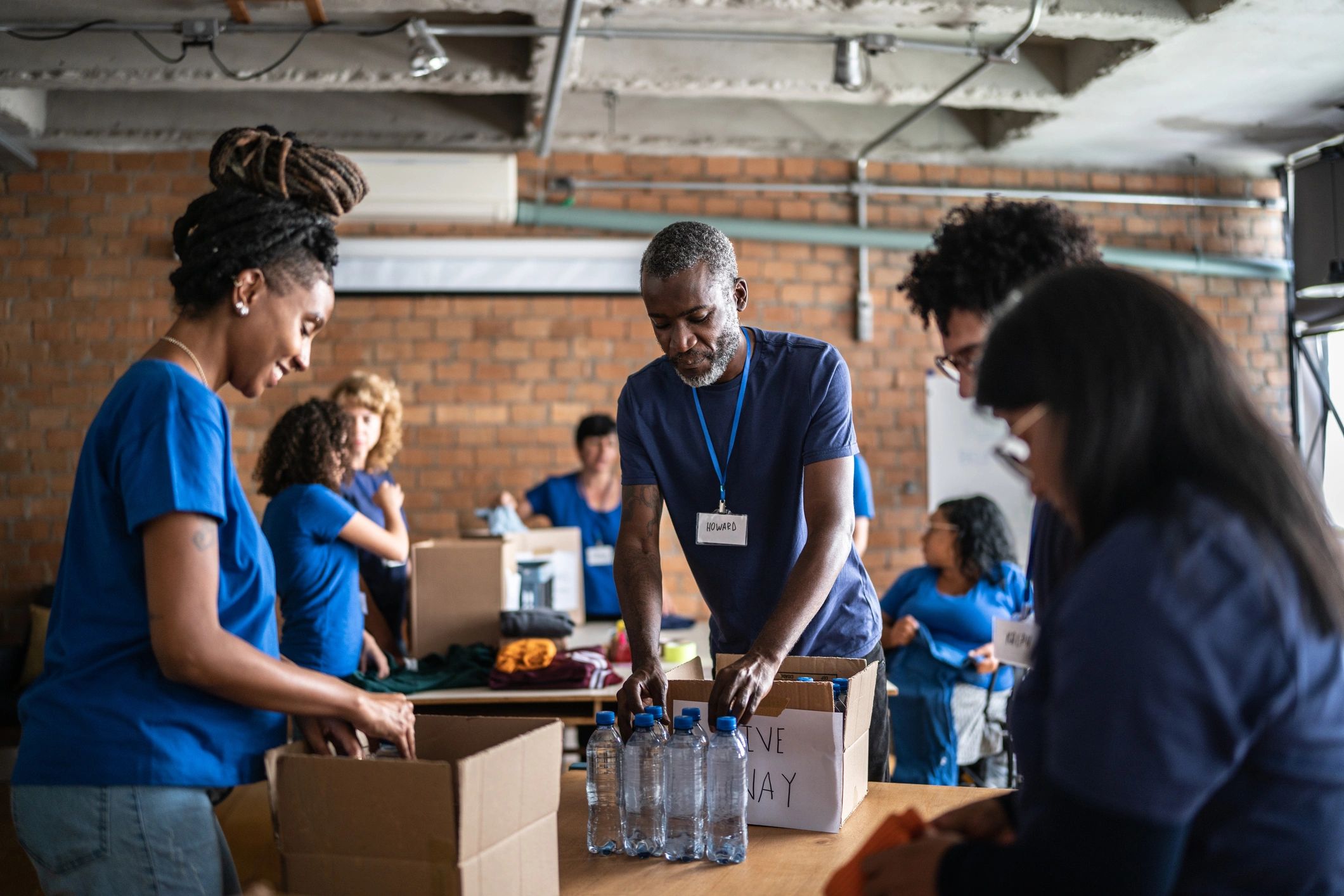 Volunteers organizing donations in a community donation center